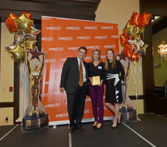 Receiving my award from the owners of StreetCity Costa and Mary at our awards banquet!